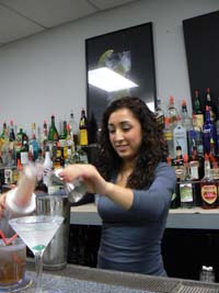 Felica Pours a Martini at Ameican Bartending School