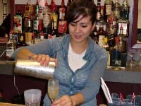 Samantha makes a whiskey sour at American Bartenders School